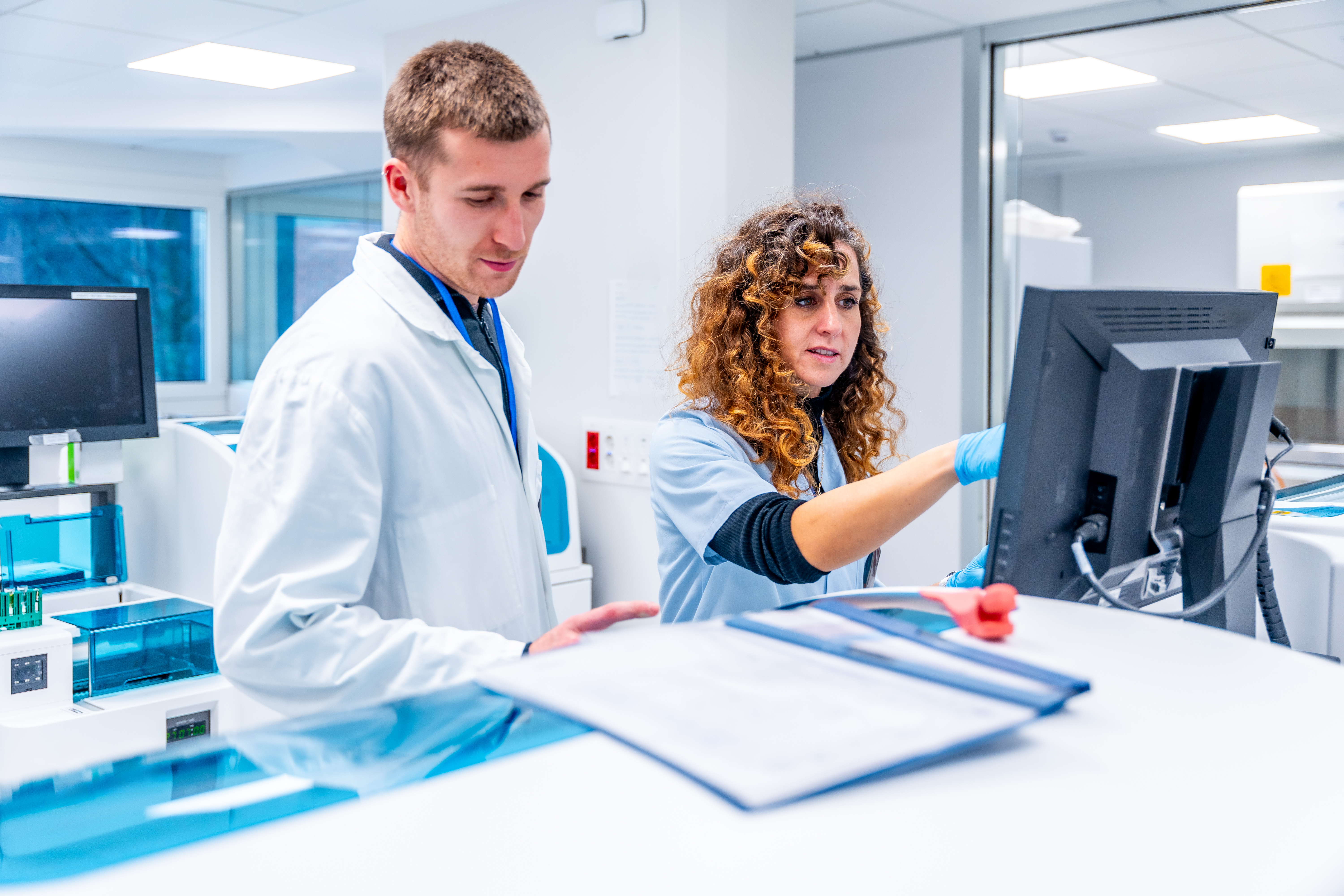 Two young scientists working together in a pathological anatomy laboratory research in an hospital